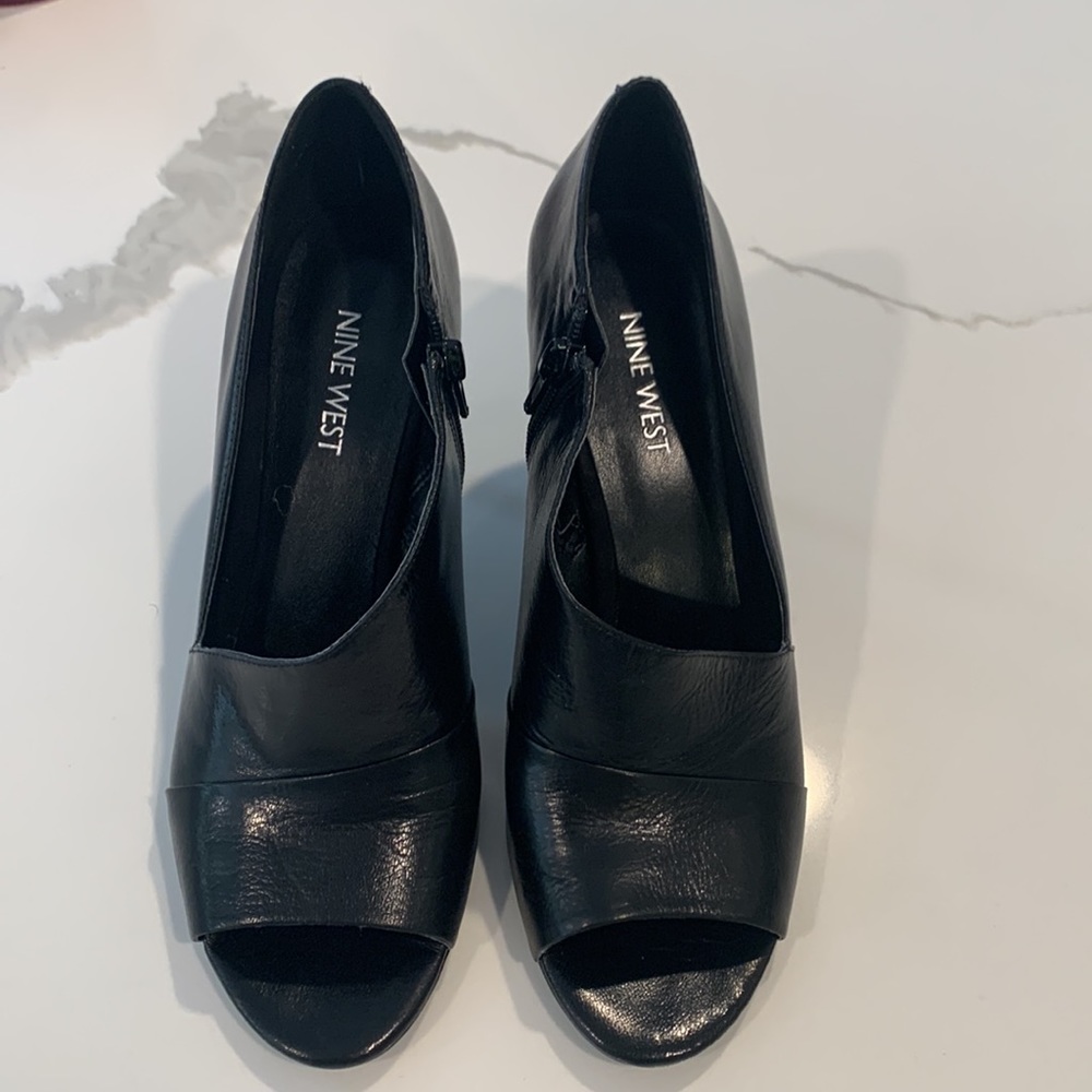 Black leather pumps